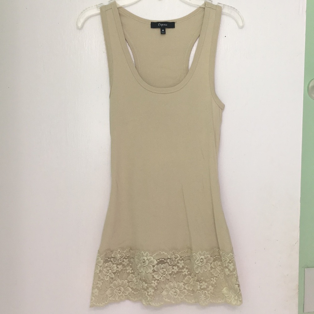 A nude tank with goldish lace floral print.